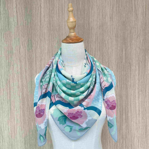 A front view of Peranakan Opulence Scarf beautifully wore on a mannequin