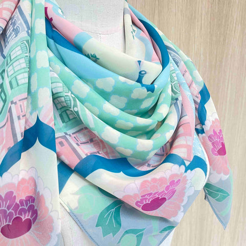 Close up view of Peranakan Opulence Scarf beautifully wore on a mannequin showcasing its floral design