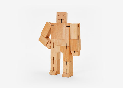 Cubebot Classic (Medium) is made from wood and elastic bands, with smooth natural grain, minimalist design, and poseable joints—timeless and tactile