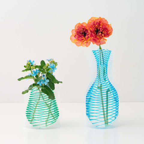 Swivel strip flower vase design with swivelling blue & green or red & pink colour and it comes in two sizes