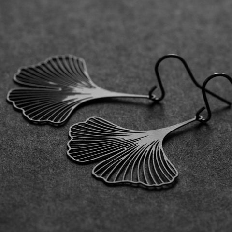 Close-up of Moorigin Stainless Steel Earrings-Ginkgo S Black, showing fine cutout ginkgo lines with a sleek, matte, nature-inspired design