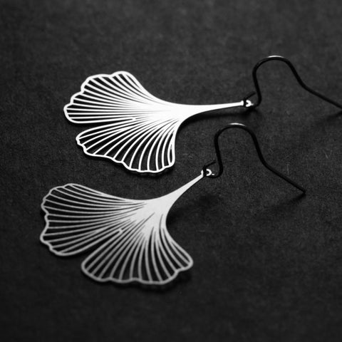 Close-up of Moorigin Stainless Steel Earrings-Ginkgo S Silver, showing delicate laser-cut ginkgo lines with a sleek, airy, nature-inspired design