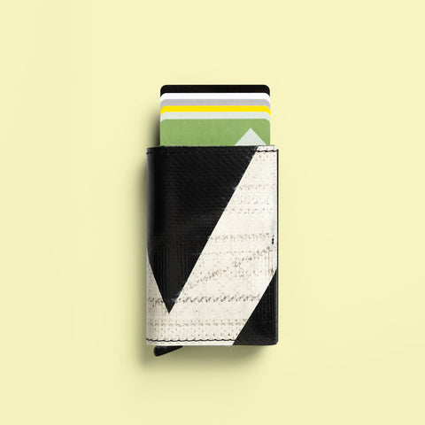 F705 SECRID x FREITAG Slimwallet protects cards with patented auto-lock mechanism and RFID safe all wrap inside FREITAG tarp shell