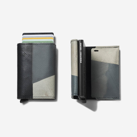 F705 SECRID x FREITAG Slimwallet protects cards with patented auto-lock mechanism with front and side view of FREITAG tarp shell