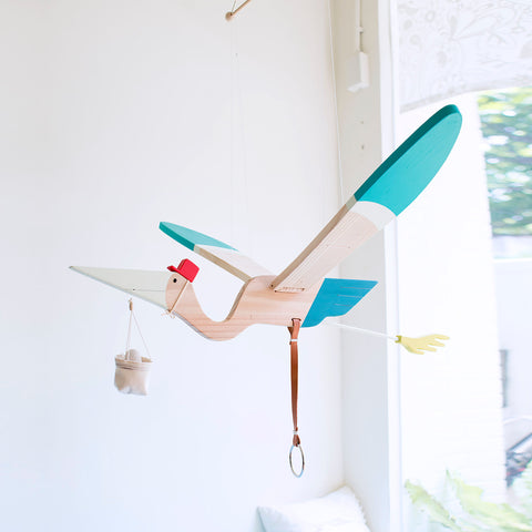 The adult Pelican mobile which comes with a pouch and a wooden egg gracefully flap it’s wing when pulled from below