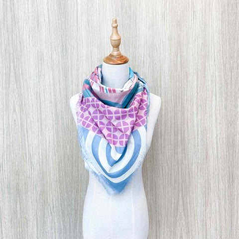 A front view of Tanjong Pagar Scarf beautifully worn on a mannequin