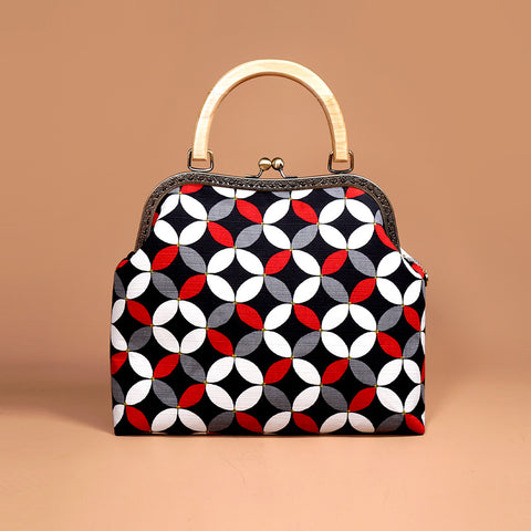 Cocoonese Kiss Clasp Handbag