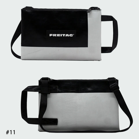 Front and back views of FREITAG F272 EDDIE crossbody bag, black and offwhite with black handle and strap.