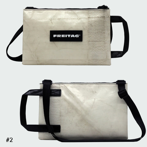 Front and back views of FREITAG F272 EDDIE crossbody bag, offwhite with black handle and strap.