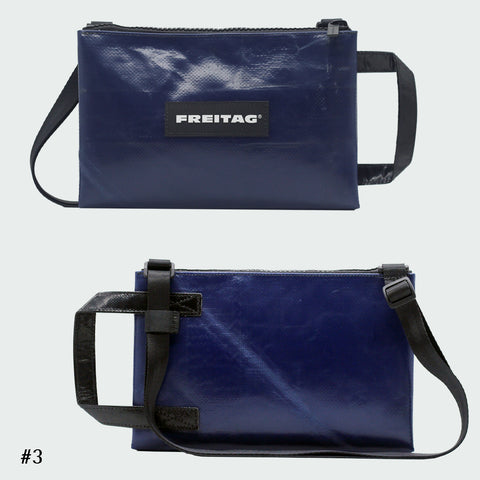 Front and back views of FREITAG F272 EDDIE crossbody bag, navy blue with black handle and strap.
