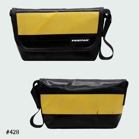 FREITAG F41 Hawaii Five-O messenger bag in black and yellow horizontal stripe, upcycled truck tarp, front and back views.