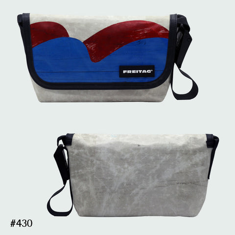 FREITAG F41 Hawaii Five-O messenger bag in offwhite with red and blue wave graphic, upcycled truck tarp, front and back views.