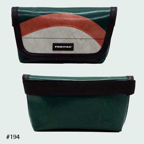 FREITAG F40 Jamie hip bag in green with red and white arc graphic, upcycled truck tarp belt bag, front and back views.