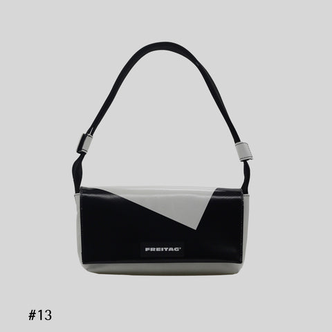 Front view of FREITAG F171 LAURA shoulder bag, white and black with black strap.
