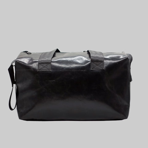 Back view of FREITAG F45 LOIS sports bag with black handles, plain black.