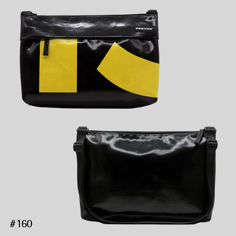 FREITAG F553 LOU shoulder bag in black with yellow accents, upcycled truck tarp crossbody, front and back views.