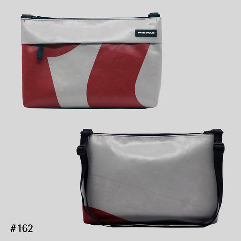 FREITAG F553 LOU shoulder bag in red and grey graphic print, upcycled truck tarp crossbody, front and back views.