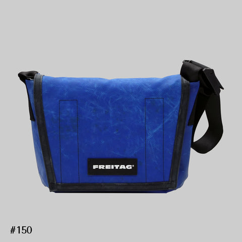 Front view of FREITAG F11 LASSIE messenger bag in blue, with black trim and black strap