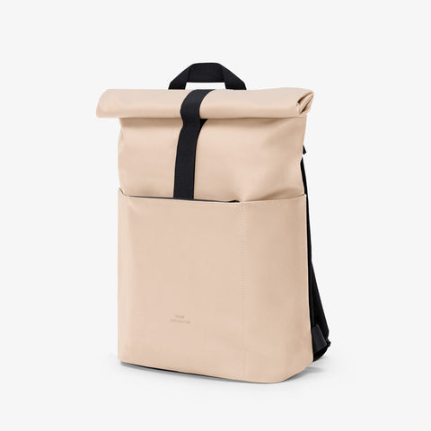 Front view of Ucon Acrobatics Hajo Mini Backpack Lotus Series with light almond colour featuring a zip compartment 