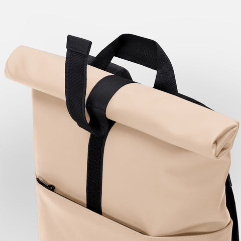 Showcasing Hajo Mini Backpack Lotus Series roll-top feature which has velco to secure its opening 