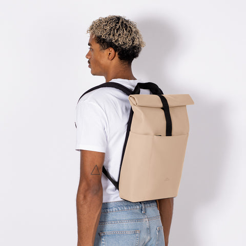 Person carrying Hajo Mini Backpack Lotus Series showing the sleek dimension