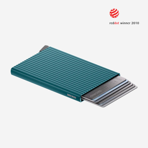 Teal card holder with fluted detail and 'SECRID' branding. 2010 Red Dot Design Award winning product