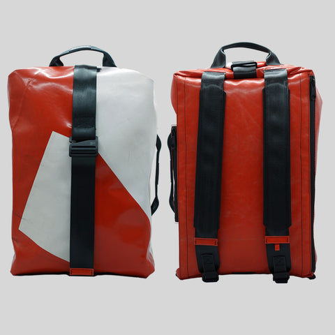 FREITAG F511 Skipper Large backpack in red and white geometric pattern, upcycled truck tarp, front and back views.