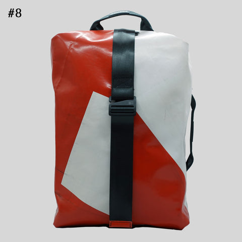 FREITAG F511 Skipper Large backpack in red and white with geometric pattern, upcycled truck tarp, front view.