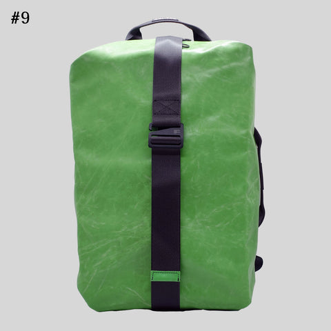 FREITAG F511 Skipper Large backpack in solid green, upcycled truck tarp with adjustable buckle strap, front view.