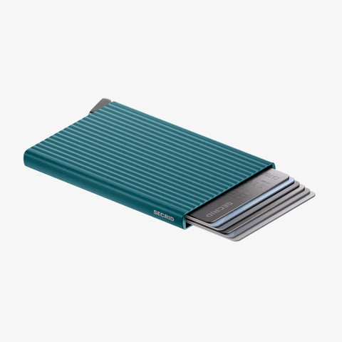 SECRID Cardprotector Fluted-Teal with ridged texture, slim metal body, and partially ejected cards for quick access in a sleek design