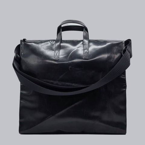 Back view of FREITAG F275 TILDA tote bag, all black with black handles and shoulder strap