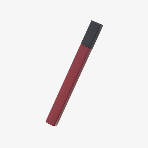Tsubota Pearl two tone lighter with its slim cubed matchstick shape with a black top and Azuki red bottom
