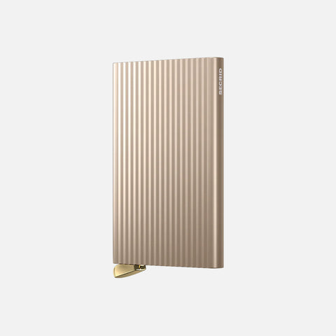 SECRID Cardprotector Fluted-Cashmere with refined grooved finish and gold lever, showcasing a sleek, premium and minimalist design